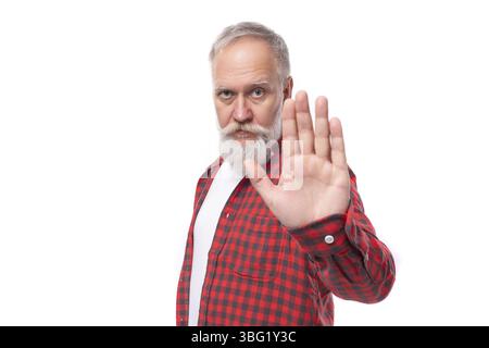 Handsome mature gray-haired man with beard won shows stop Stock Photo