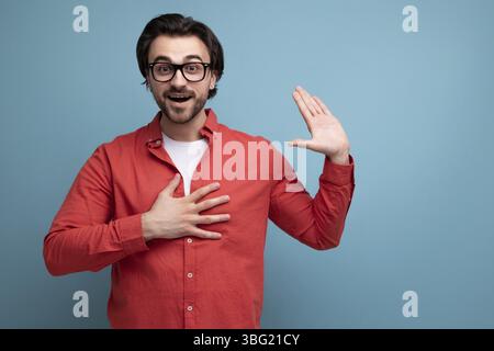 Smart handsome young brunette man with glasses explains an idea Stock Photo
