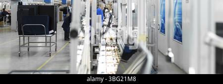 Workshop on assembling telephysics. Testing TVs in the workshop. Electronics assembly line Stock Photo