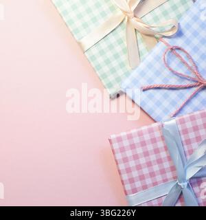 Check pattern colorful gift boxes on pink background Stock Photo