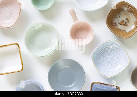 Colorful empty plates on white background. flat lay, top view Stock Photo