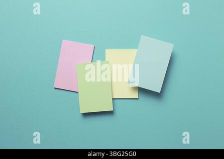 Colorful memo pad, sticky notes on mint background Stock Photo