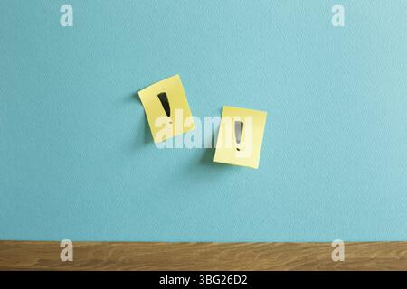 Sticky notepad with exclamation mark on blue wall. Thinking, solution, business, idea concept Stock Photo