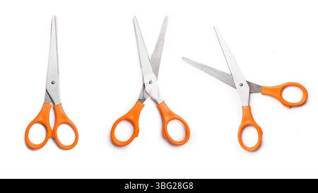Orange multipurpose scissors set isolated on white background. Open and close scissors. Stock Photo