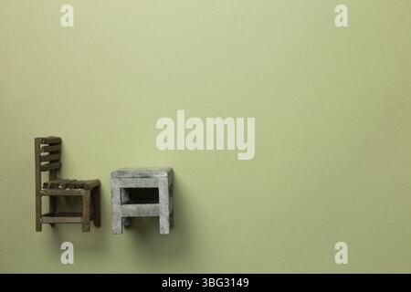 Old school desk and chair on khaki green background. top view, copy space Stock Photo