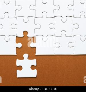 Set of white puzzle pieces and last one piece Stock Photo