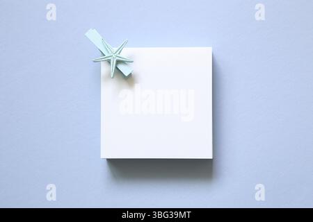 Memo pad, sticky note on blue background Stock Photo