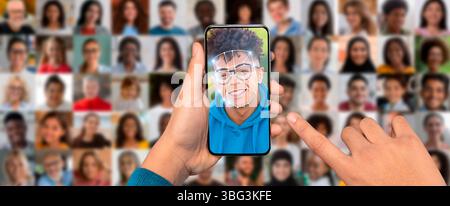 A person is engaging with a smartphone displaying a face scanning feature Stock Photo