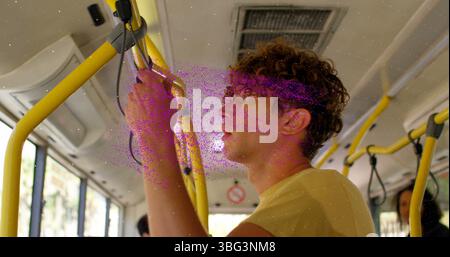 Image of pink nft text over thoughtful caucasian man travelling on bus Stock Photo