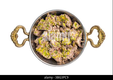 Halva with tahini and pistachio isolated on a white background. Natural vegan sweets. Stock Photo