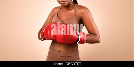 Self-Defence Classes. Portrait Of Young Sporty Black Woman Wearing Boxing Gloves Stock Photo