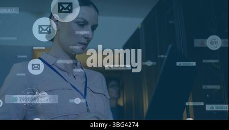 Image of falling icons over caucasian female server room worker Stock Photo