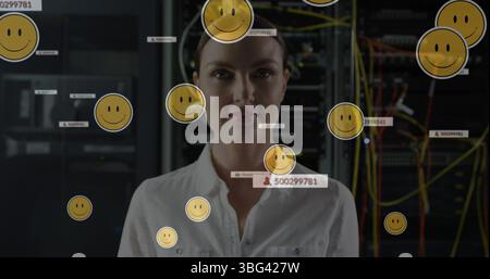 Image of falling icons over caucasian female server room worker Stock Photo