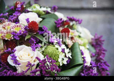 Bouquet of pink roses, limonium, arabian star flower (ornithogalum arabicum) and miniature chrysanthemums. Party decor Stock Photo