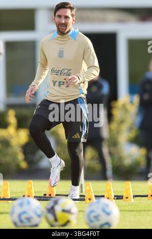 Argentina’s national team forward Lionel Messi (R) looks on during a