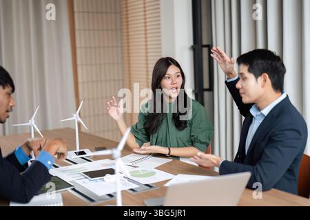 ESG Engagement in Corporate Meeting. Team members discussing sustainability goals. Stock Photo