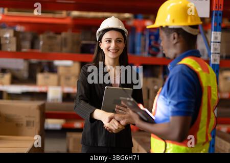 engineer male worker team meeting with business woman manager owner hand shaking happy smiling Stock Photo