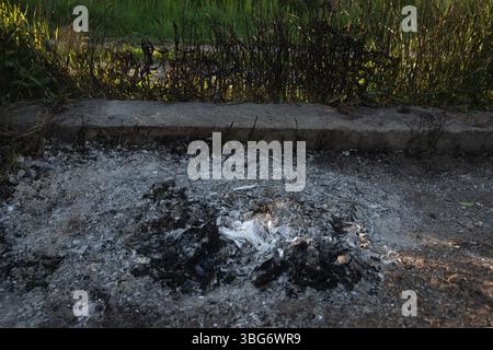 Burned Ashes and Charred Debris Close-Up, Grunge Background Stock Photo