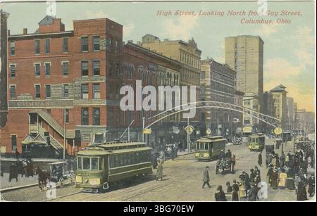 A 1910 colorized postcard of North High Street in Columbus, Ohio, showing streetcars, pedestrians, and an arch over the road north of Gay Street. Stock Photo