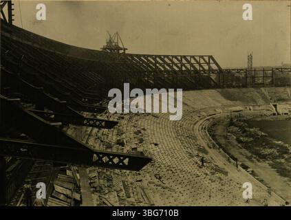 The Ohio State University Stadium, under construction in Fall 1922, shows girders and seating being installed. The project, which started with the groundbreaking on October 21, 1922, will eventually become known as the Horseshoe. Stock Photo