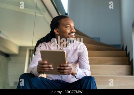 Happy software developer man working on project. Programming advanced code artificial intelligence Stock Photo