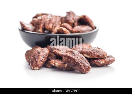 Pecan nuts coated in sugar and honey isolated on a white background. Stock Photo