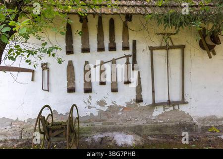 Vintage Hand Tools Hanging on a Wall in a Traditional Croatian Village Home Stock Photo