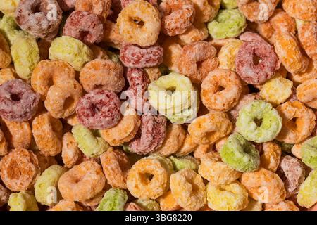 Full frame photo of round multicolored cereals, top view. Breakfast cereal concept. Stock Photo