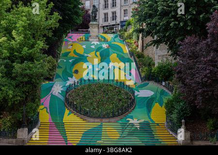 A vibrant, colorful mural covers a staircase in an urban park, surrounded by lush greenery. The artwork features abstract floral and leaf patterns in Stock Photo