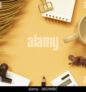 Workspace concept. Note, memo pad, clip, pencil, calculator, mug cup, plant on orange desk background. flat lay, top view, copy space Stock Photo