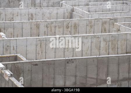 Concrete walls of basement foundation at a construction site Stock Photo