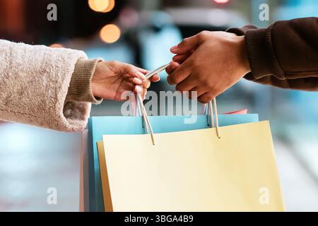 Black couple holding shopping bags with blank space for template Stock Photo