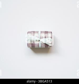 Purple check pattern gift box isolated on white background. top view Stock Photo