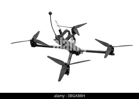 Carbon frame FPV racing drone with four propellers and visible camera, isolated on white background. Stock Photo