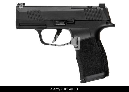 Side view of compact black semi-automatic pistol isolated on white background. Stock Photo