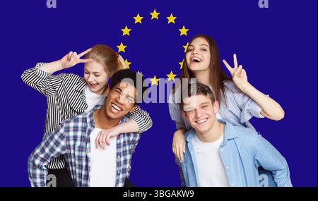 Group Of Happy Multi Ethnic Students Standing In Front Of EU Flag Stock Photo