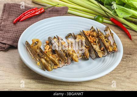 Steamed razor mollusk with lemongrass and garlik Stock Photo