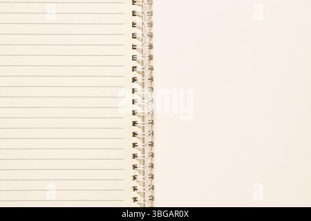 Open spiral notebook with blank lined sheets as a background for notes, planning and studying Stock Photo