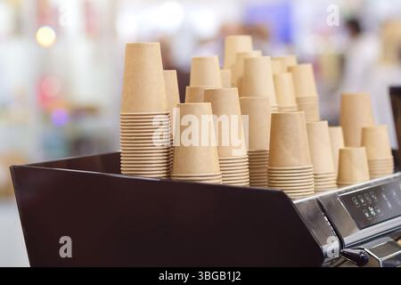 Lot of drinking paper coffee cups in piles. Stack of disposable coffee cup Stock Photo