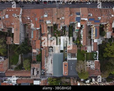 Top-down drone view of Padova’s historic rooftops and courtyards, revealing the city’s dense urban fabric and architectural charm. Stock Photo
