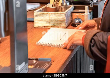 Ordering dessert at a cafe at a meeting of friends during a lunch break to discuss important ideas for work Stock Photo