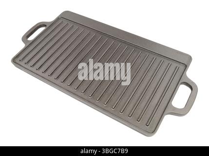 Cast iron metal griddle pan with handles incorporated isolated on a white background Stock Photo