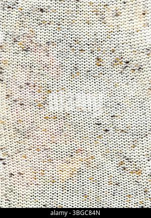 Speckled cream coloured knitted wool jumper texture background Stock Photo