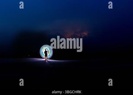circular light painting in the desert night Stock Photo