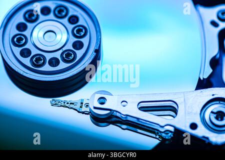 Macro photograph showcasing intricate details of a hard disk drive, highlighting data storage mechanisms Stock Photo