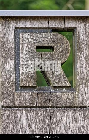 Rennsteig hiking trail in the Thuringian Forest mountain range in Oberhof, Thuringia. R sign logo on the long-distance trail in Central Germany. Stock Photo