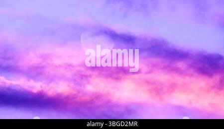 A Full Moon Against A Detailed Colorful Cloudscape Banner Header Stock Photo