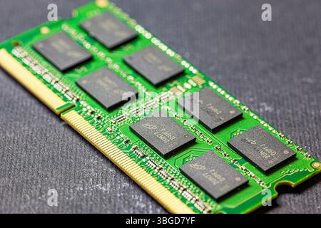 Milan, Italy 1 January 2025: Closeup of a computer ram memory module lying on a dark background, representing electronic components and modern technol Stock Photo