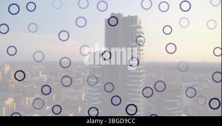 Image of falling circles over cityscape Stock Photo