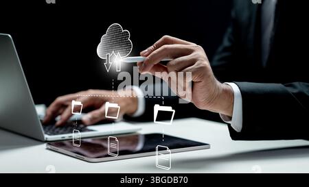 Businessman using tablet while touching cloud network icon from tablet screen. Technology innovation on a virtual screen. Concept of data management s Stock Photo